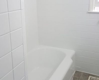New brilliant white glaze and grout creates a permanent new surface for your bathroom tile.